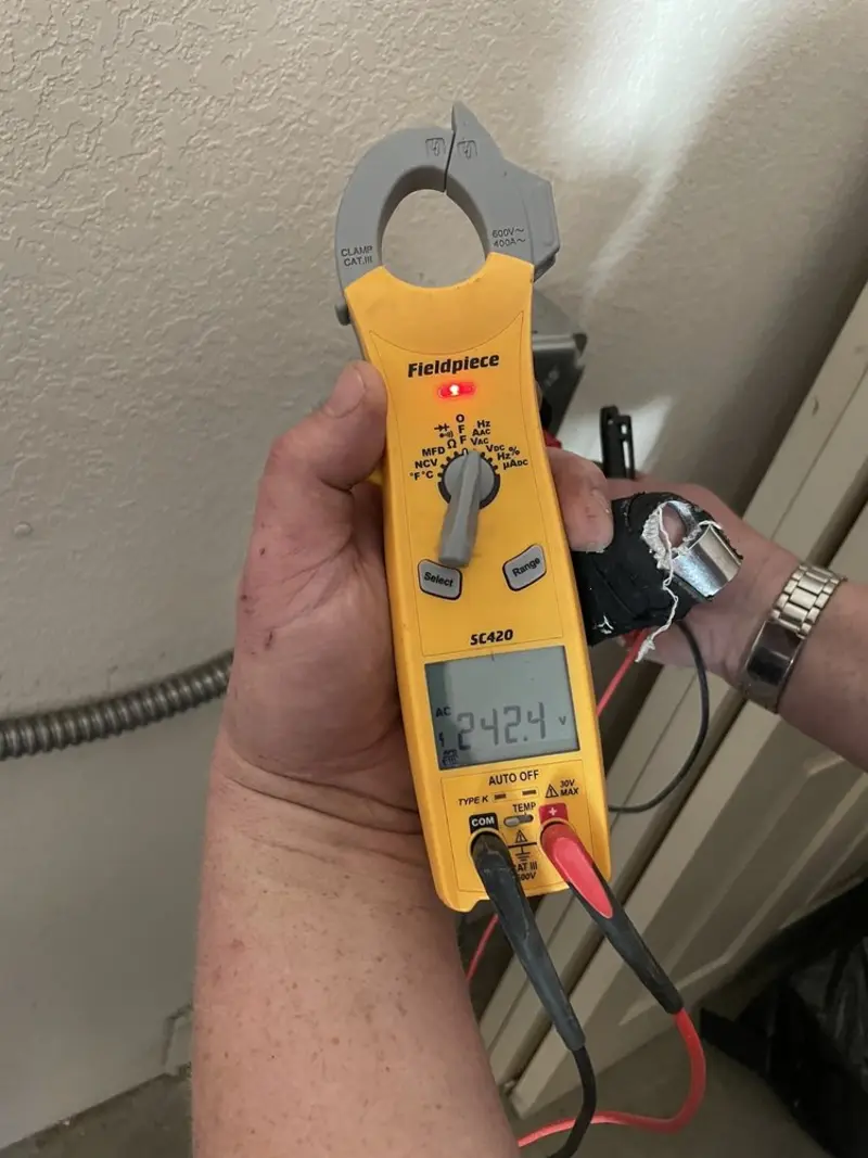 Voltage testing with clamp meter during Whole House Surge Protector in Coquille